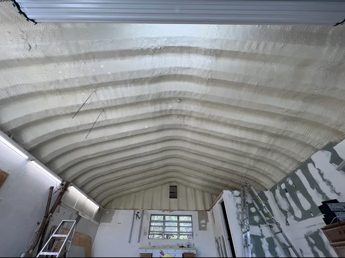Spray polyurethane foam applied to the underside of a metal roof deck in Northdale